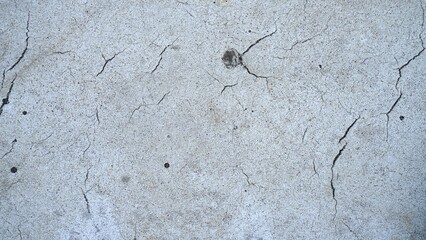 Close-up road texture painted white as background. White dividing line road close up