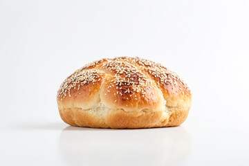 Close-up of a round, golden-brown sesame seed loaf of bread on a white background.