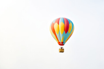 Fototapeta premium Colorful Hot Air Balloon Soaring Through the Sky