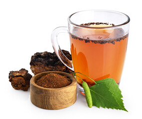 Chaga mushroom pieces and chaga mushroom tea isolated on white background. With clipping path.