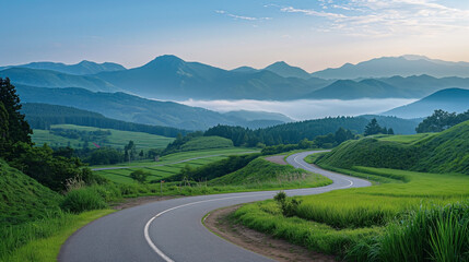 Obraz premium A stunning photograph of a winding road in Hokkaido, Japan. The road snakes through a picturesque landscape, 