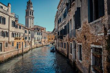 view of old venetian houses at canal with a bell tower