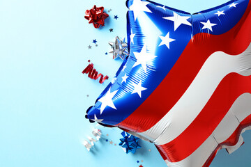 US Independence Day concept. Top view foil balloon in American flag colors and decorations on blue...