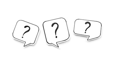 Question marks on paper speech bubbles, top view. Ask and answer concept