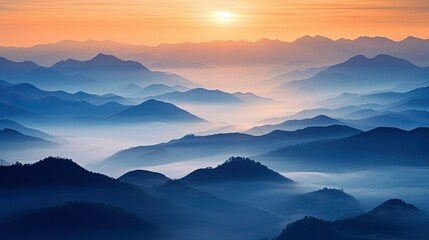 Fototapeta premium Photograph of a serene sunrise over a misty mountain range, with the peaks silhouetted against the glowing sky.