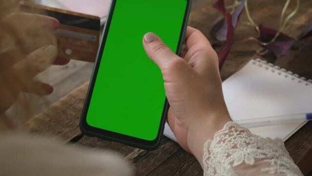 Online shopping, e-commerce payment using smartphone and plastic bank card.