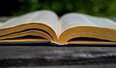 Open book on the table in park