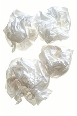 Fototapeta premium A pile of crumbled white paper sitting on a table