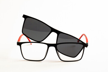 Myopia glasses, magnetic sunglasses set,on white surface with copy space