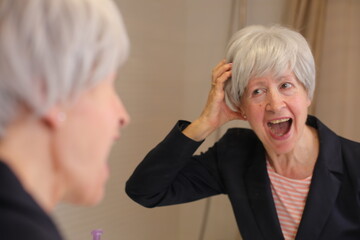 Mature woman with a nervous evil smile 
