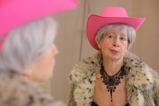 Senior cowgirl reading for some horse riding with glamous 
