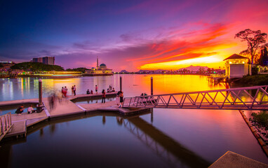 the view of the river and the pier in the red twilight