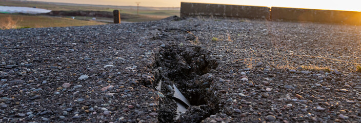 Cracked old asphalt, road safety concept