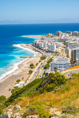 Fototapeta premium Aegean beach with sunshades in city of Rhodes (Rhodes, Greece)