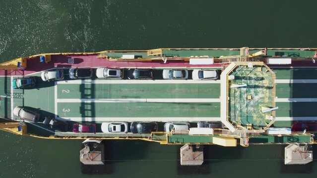 Aerial View of Car Ferry with Vehicles Onboard at Sea, Overhead Perspective