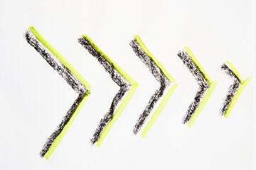 A bright neon, green and black arrow like a herringbone hand-drawn on a white background. The...