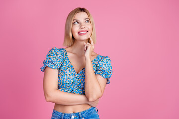 Portrait of nice young lady bite lips look empty space wear top isolated on pink color background