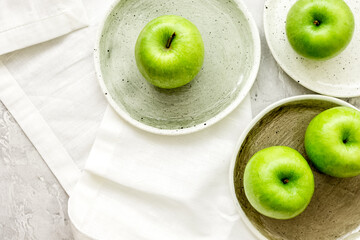 fresh organic green fruits with apples on stone background top view