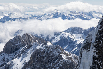 Panoramic view of snow-capped mountains from the Zugspitze peak in the Alps

