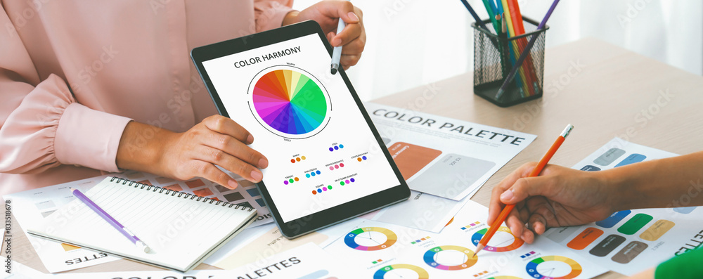 Poster a cropped picture of professional designer selects the color by using color theory and comparing wit