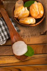 Assortment of fresh organic fruits and vegetables in basket on background, closeup.
