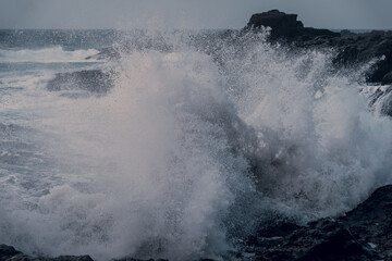 waves beating against the rocks in El Puertillo at sunset. Arucas. Gran Canaria. Canary islands