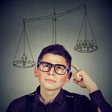 Man making a decision with scale above head and people on a balance