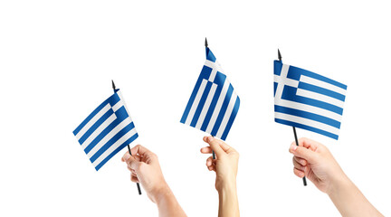 A group of people are holding small flags of Greece in their hands.
