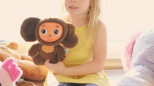 young girl's tender bond with soft toy, first childhood friends, childhood happiness, creativity and storytelling skills, Innocence and joy, solace and friendship in embrace cuddly plush toys