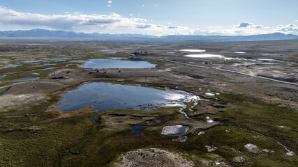 landscape of the surroundings of the village of Kosh Agach mountains with lakes and unusual landscapes from the height of a drone flight in the southern regions of Altai in May