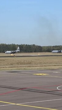 Military Airplanes Taxiing at Air Base