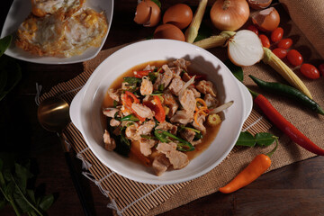 Stir-fried pork with basil, Thai food, fresh vegetables, ingredients on the table
