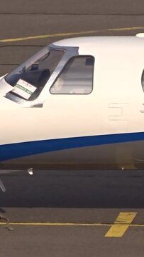 Generic White Unmarked Business Jet Private jet Executive jet Corporate jet Parked at International Airport General Aviation Terminal.