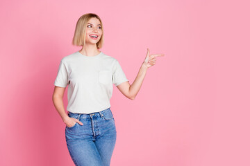 Portrait of good mood girl with bob hair wear white t-shirt directing look at discount empty space...