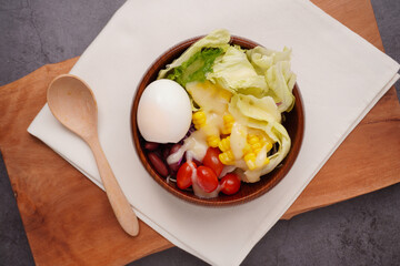 Mixed vegetable salad and boiled eggs, healthy food