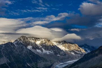 Chamonix Montblanc beautiful alpine mountain summits landscape. Alps mountains with snow and glacier above green valley of Chamonix in France. Alps beautiful scenery in summer