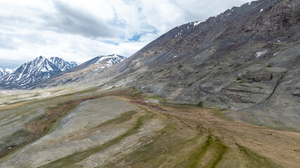 stunning landscapes of mountains, lakes and rivers from a drone flight in the southern regions of Altai in May