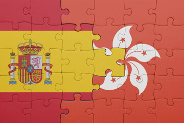 puzzle with the colourful national flag of hong kong and flag of spain.