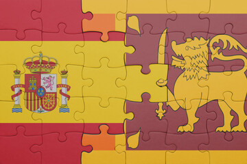 puzzle with the colourful national flag of sri lanka and flag of spain.