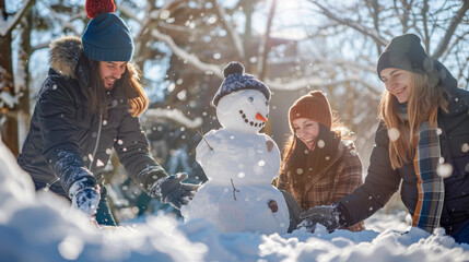 Group of People Building a Snowman in the Snow