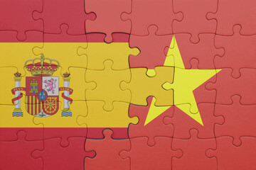 puzzle with the colourful national flag of vietnam and flag of spain.