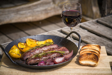 ready to eat, served in a pan a grilled tenderloin from roe'meat with yellow paprika, onions and...