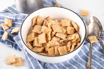 Cinnamon toast crunch mix in portioned bowl with milk. Sweet Trendy Crunchy Cinnamon Breakfast Cereal 