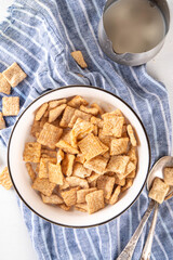 Cinnamon toast crunch mix in portioned bowl with milk. Sweet Trendy Crunchy Cinnamon Breakfast Cereal 