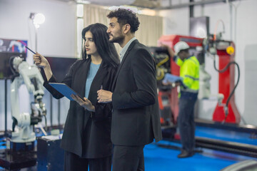 Robotic engineer and team oversee software, machine tool performance, enhance program for efficiency