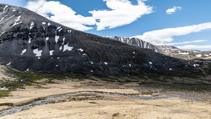 stunning landscapes of mountains, lakes and rivers from a drone flight in the southern regions of Altai in May