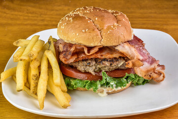 blt hamburger on a sesame bun