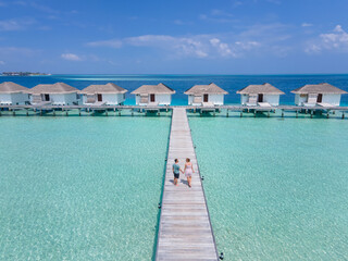 happy couple on honeymoon trip in Maldives, beach holidays travel
