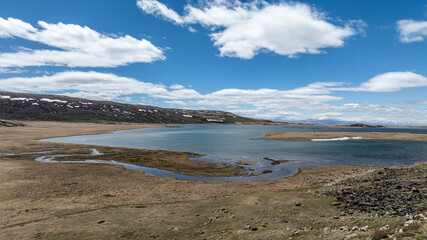 stunning landscapes of mountains, lakes and rivers from a drone flight in the southern regions of Altai in May