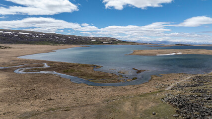 stunning landscapes of mountains, lakes and rivers from a drone flight in the southern regions of Altai in May